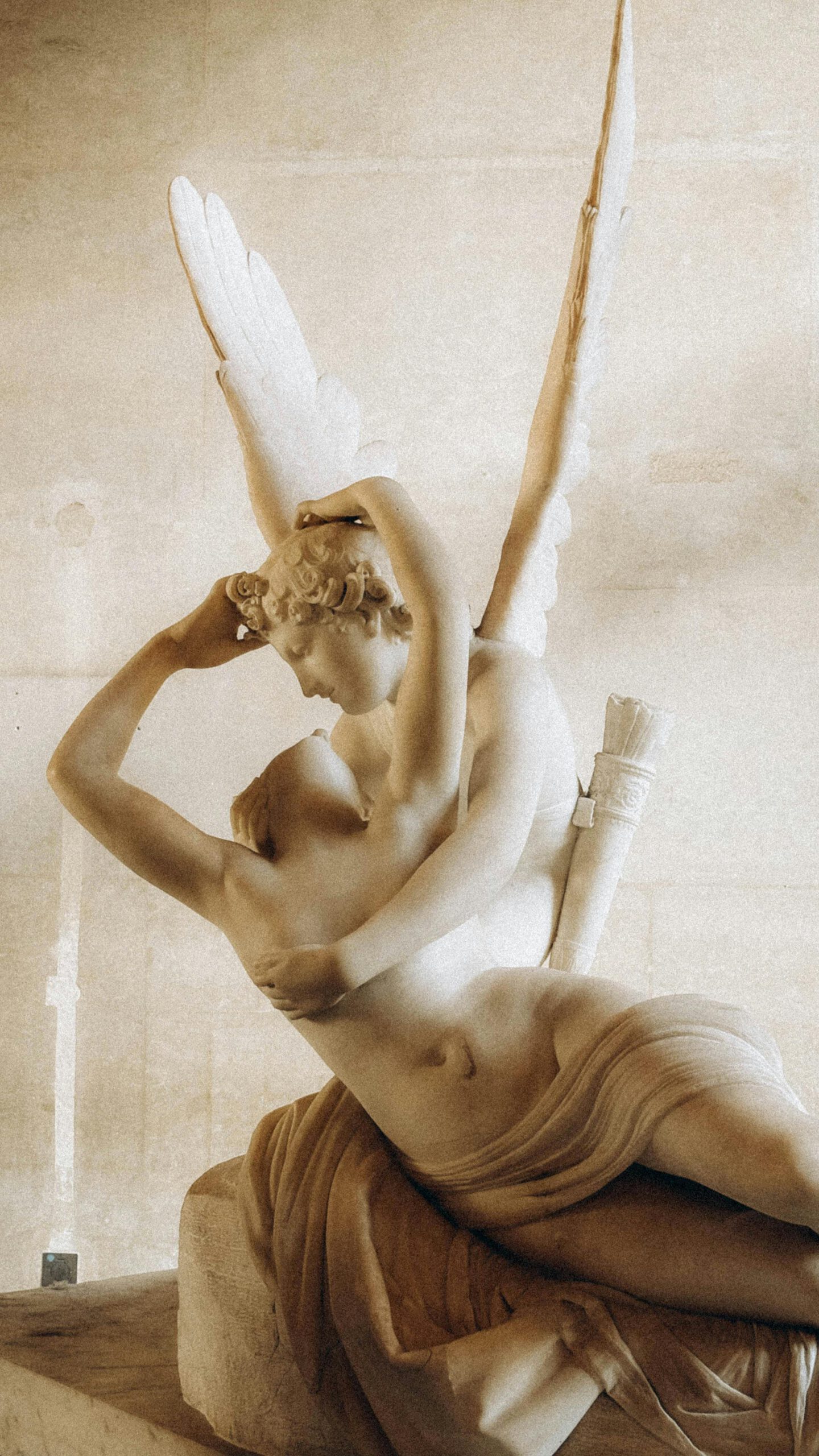 services-01 Elegant marble sculpture of Psyche and Cupid in Louvre Museum, Paris.
